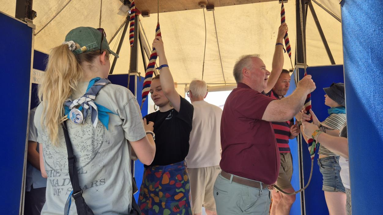 Young people and ringers taking part in a bell-ringing activity
